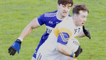Grangenolvin wing back Brian Cullen skips through the challenge from St Brigids Croghan Dan Molly during the 2025 AIB Leinster Gaa Junior Club Football Championship Round 1 