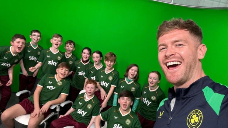 Ireland captain Nathan Collins surprises students from his former primary school in Kildare