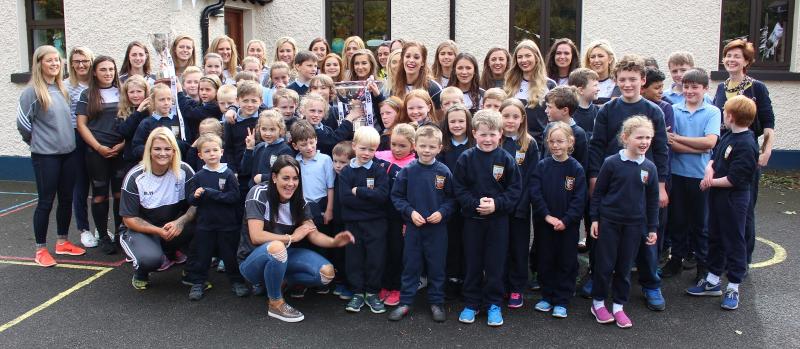 Kildare captain Aisling Holton brings cup to her pupils in Brannoxtown NS