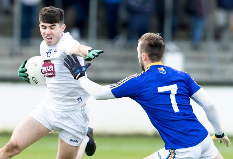 Kildare's Jack Robinson pushes his way past the challenging Gerard Flynn of Longford during the Leinster Gaa Series O'Byrne Cup 