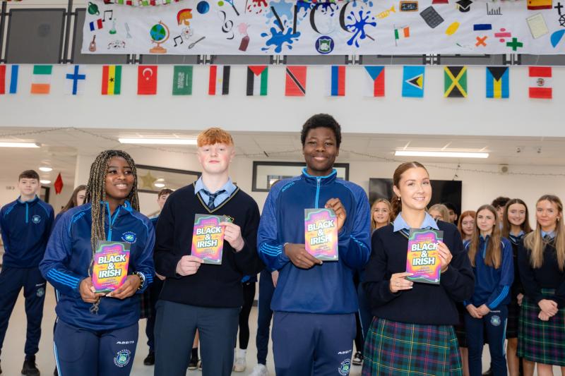 Students receiving the books