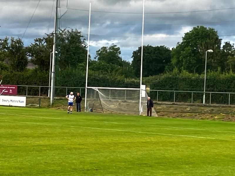 Kildare legend Pat Dunney on umpire duty with a cup of tea in hand for Championship opener