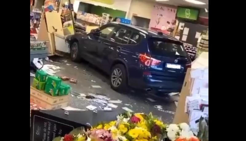 Shoppers in shock as car smashes through store front 