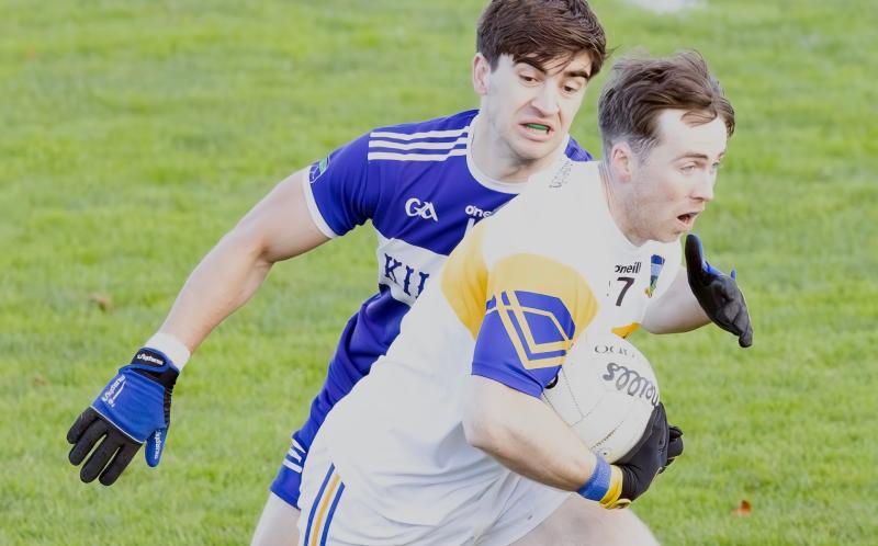 Grangenolvin wing back Brian Cullen skips through the challenge from St Brigids Croghan Dan Molly during the 2025 AIB Leinster Gaa Junior Club Football Championship Round 1 