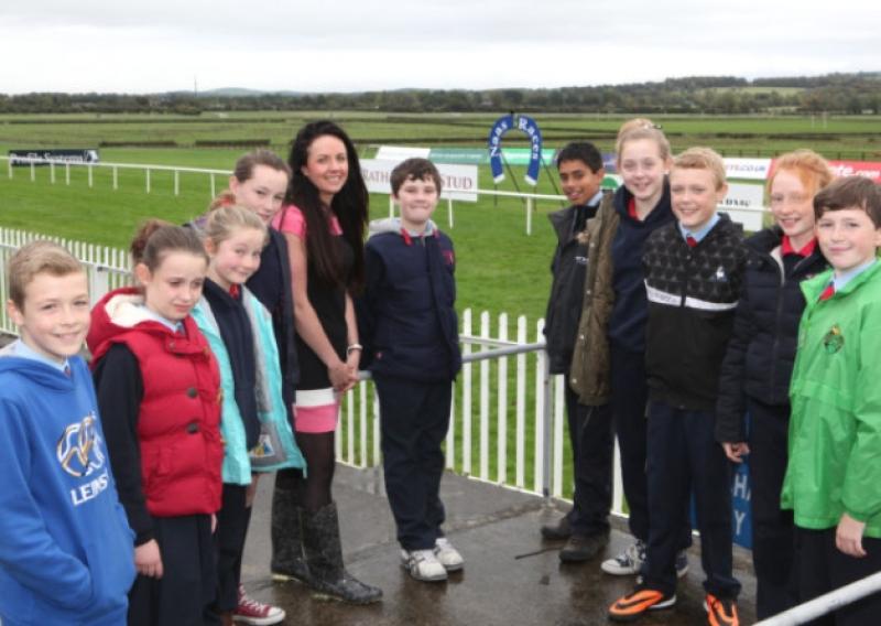 Edel McCabe, Marketing Manager Naas Racecourse pictured with pupils from Caragh NS.