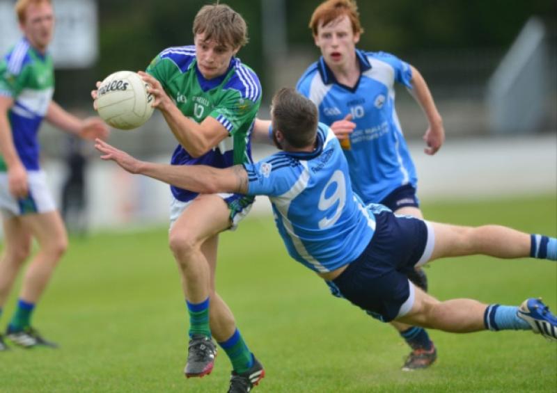 Ian McKeown of Johnstownbridge gets past Jonathan Byrne of Allenwood in the Senior Football Championship round two game.