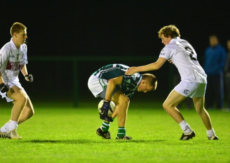 11-10-2013Confey's Sean Kilbane keeps the ball from Sean Lynch and Andy Malone of Clane in the Minor B football final replay at Hawkfield.Photo: Adrian Melia