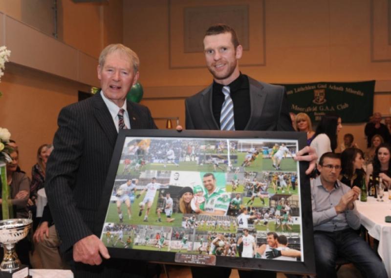 Ronan Sweeney recieves his award from guest of honourM�che�l � Muircheartaigh.
