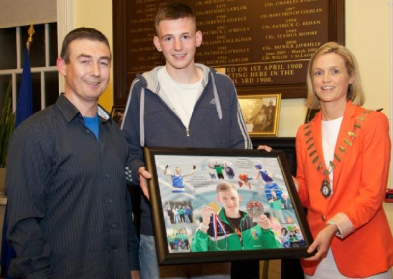 Gary Cully  receives a special presentation from Naas Town Council, with Paul Archbold, coach at St. David's Boxing Club, Naas, and Mayor of Naas Emer McDaid. Photo Tony Keane.