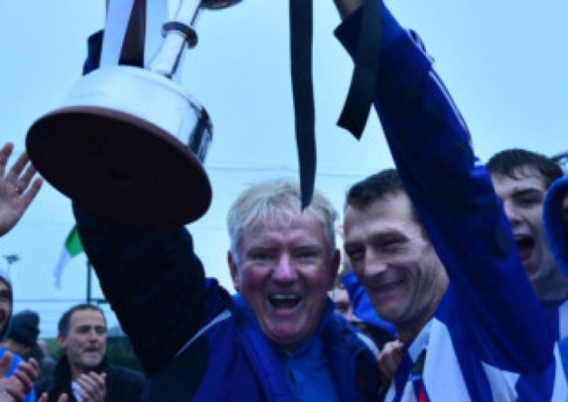 Castle Villa captain Anto Lawlor celebrates with the cup and Liam Murphy after victory over Naas United in the Kildare & District Football League CR Wynne Feeds Senior Division decider at Mullarkey Park last season.