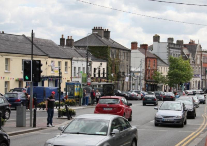 Drunk man lying on grass in Naas