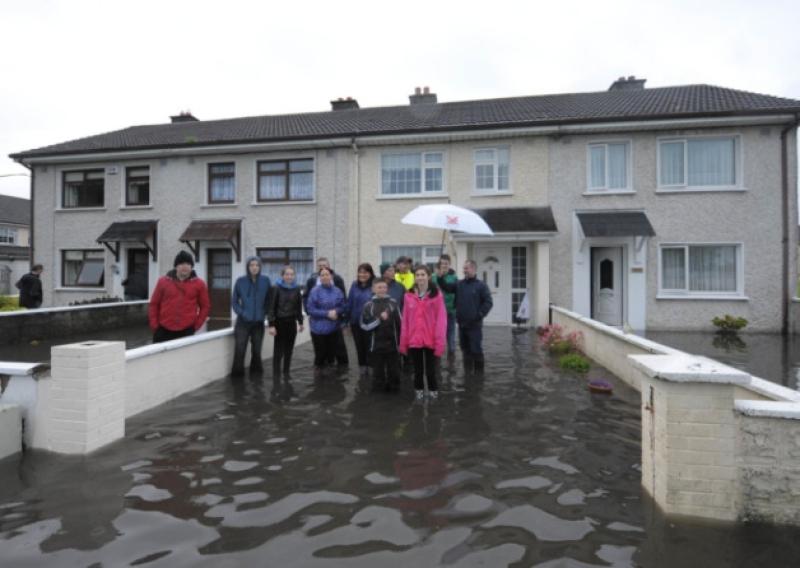 Dara Park residents outside their flooded homes. Photo: Jimmy Fullam.