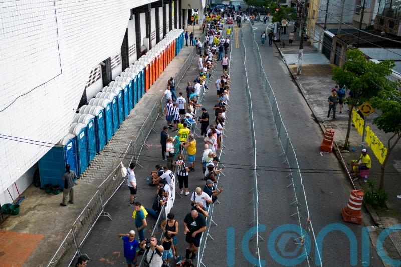 Fans line up at stadium to mourn Pele ahead of funeral