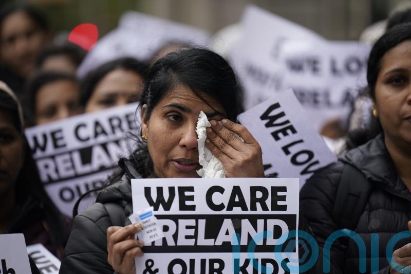 ‘Heartbroken’ migrant health workers protest outside Leinster House
