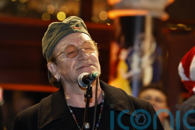 Bono joins annual Dublin city centre Christmas Eve busking session