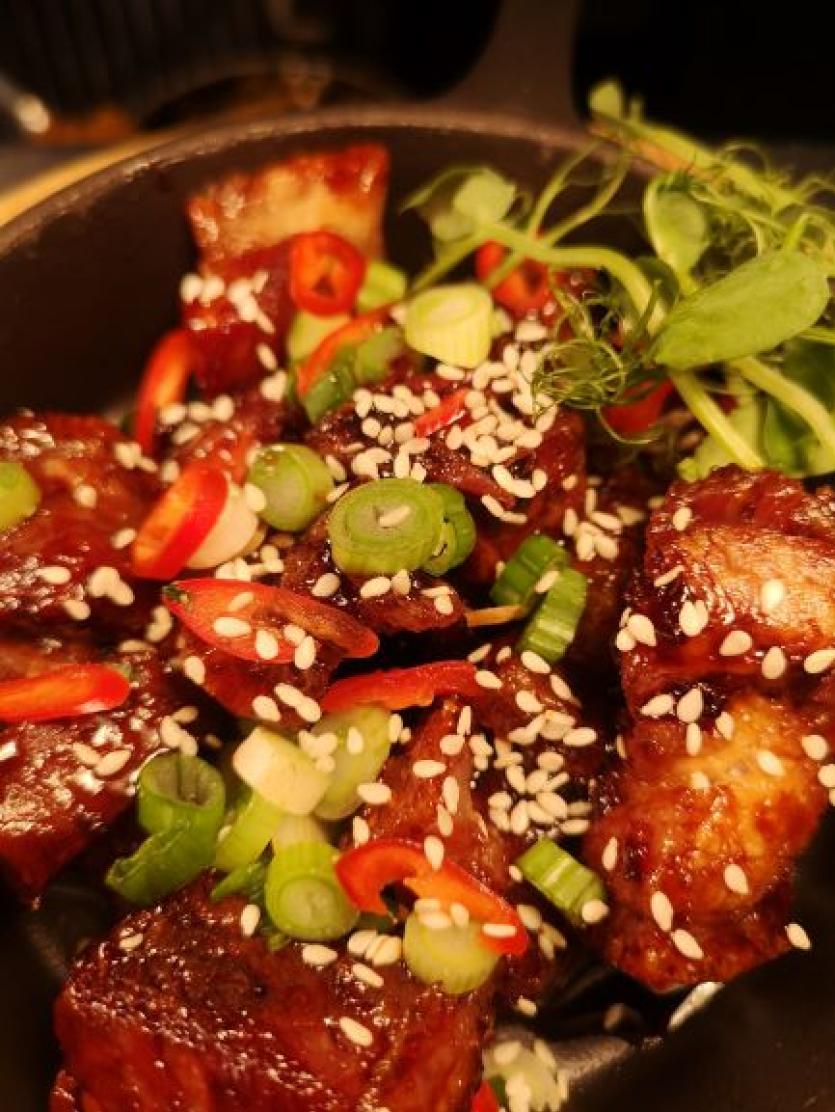 12 hour slow cooked pork belly bites, served with teriyaki sauce, sesame seeds, chilli and spring onions