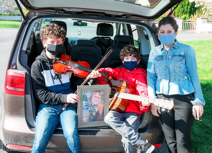 Sarah Gallagher with her sons Tom and Joe who played some traditional Irish Music 